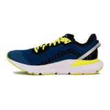 Championes de running Diadora Mythos Blushield Volo 3, con diseño multicolor que combina blanco, amarillo, azul, rojo y negro. Presentan una estructura de malla transpirable, cordones negros y suela con tecnología de amortiguación.