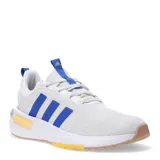 Championes Adidas Racer TR23, color gris claro con detalles en azul francia y suela color caramelo.