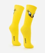 Par de medias de algodón amarillo con caña mediana y estampado del personaje Piolín (Piu Piu) de Looney Tunes.
