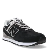 Championes urbanos New Balance modelo 574, color negro con detalles en gris y blanco, confeccionados en gamuza y malla, con logo "N" característico en los laterales y entresuela ENCAP.