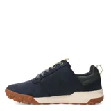 Zapatos Caterpillar modelo Hex Ready Lo, color azul marino, estilo casual/outdoor de caña baja. Presentan capellada de nobuk o material similar, cordones grises jaspeados, tirador trasero en color beige claro y suela bicolor con entresuela color crema y suela exterior de goma marrón con diseño de hexágonos.