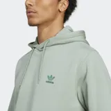 Canguro con capucha color verde claro, con cordones ajustables y bolsillo tipo canguro. Logo del trifolio bordado en el pecho.