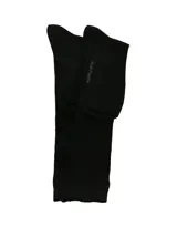 Medias largas de caña alta, color negro, con textura acanalada, diseñadas especialmente para usar con botas.