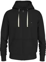 Buzo negro de felpa de algodón con capucha y cordón ajustable, cierre de cremallera frontal, bolsillos tipo canguro y logo de Tommy Hilfiger bordado en el pecho.
