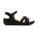 Sandalias negras con plataforma baja, tiras anchas cruzadas sobre el empeine y tira con hebilla al tobillo.