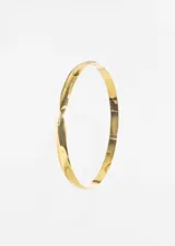 Pulsera rígida tipo esclava de acero quirúrgico hipoalergénico color dorado.