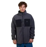 Campera de micropolar gris con cuello alto y cierre frontal completo. Presenta paneles frontales en color negro a la altura del pecho y bolsillos laterales.