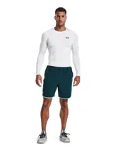 Remera de compresión de manga larga Under Armour, confeccionada en tejido HeatGear ultraligero que absorbe el sudor y se seca rápidamente. Presenta un diseño ergonómico con mangas raglán híbridas y paneles de malla estratégicos en axilas y espalda para mayor ventilación.
