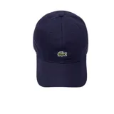 Gorra de béisbol Lacoste color azul marino, con el logo del cocodrilo bordado en el frente.