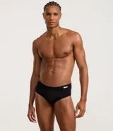 Calzoncillo slip negro de poliamida con cintura elástica y logo Mash en blanco.