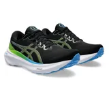 Championes de running Asics Gel-Kayano 30, color negro con detalles en verde lima y celeste, entresuela blanca y suela azul.