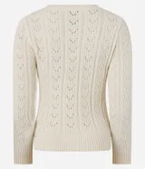 Cardigan de punto color crema con cuello en V, cierre frontal con botones y detalle de volado en el ruedo. Presenta mangas largas y un diseño texturizado con calados verticales.