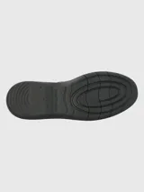 Zapato de cuero negro con cierre de velcro, suela de goma EVA flexible y diseño ergonómico.