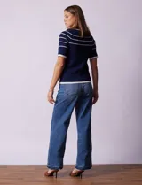 Buzo azul de tejido acanalado marca Rio & Rian. Tiene escote a la base y apliques de botones en la sisa.