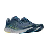 Championes de running New Balance Fresh Foam X 1080v12, color azul con detalles en amarillo y gris.