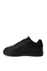 Championes deportivos Puma modelo Caven III, color negro con detalles en plateado y suela de goma negra.