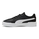 Championes Puma modelo Carina 3.0, de color negro con la franja característica en blanco y suela de plataforma acanalada. Presenta detalles de la marca en dorado.
