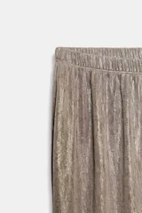 Pantalón bombacho de tiro medio con efecto metalizado, cintura elástica y bajo acabado en puño elástico.