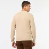 Sweater de punto con textura gofrada, cuello redondo y mangas largas, de corte estándar.