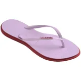 Ojotas Havaianas modelo Slim Point, con base color violeta claro y borde lateral en tono rojizo. Presentan tiras finas con textura y logo de la marca en relieve.