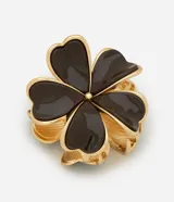 Pinza para el pelo con diseño de flor de cinco pétalos, estructura metálica con baño dorado y revestimiento esmaltado en color marrón oscuro.