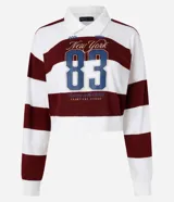 Blusa de malla de algodón con cuello de solapa y mangas largas. Tiene patrón de rayas bold y estampa delantera con lettering sportcore.