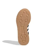 Championes deportivos Adidas Run 72S 2.0, color negro con tres franjas laterales blancas. Presentan puntera y talón en gamuza, cuerpo de malla y entresuela blanca con tecnología Cloudfoam. La suela exterior es de goma color caramelo.