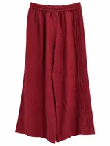 Pantalón wide leg de lino color bordó, con cintura elástica fruncida y detalles de alforzas y costuras decorativas laterales.