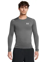 Remera de compresión de manga larga Under Armour, diseñada con tejido HeatGear ultraligero que absorbe el sudor y se seca rápidamente. Presenta un ajuste ergonómico, mangas raglán para mayor movilidad y paneles de malla estratégicos para ventilación.