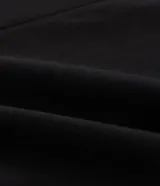 Blazer alargado azul marino de crepé, sin cierre, con solapas y mangas fruncidas.