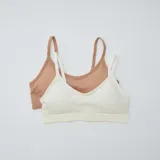 Pack de dos tops de canalé sin costuras, tipo soutién deportivo de uso diario. Uno en color tostado y otro en color blanco, con tirantes finos.