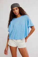 Remera corta de corte relajado y silueta holgada de la colección We The Free, confeccionada en una mezcla de lino y algodón con acabado jaspeado y cuello redondo.