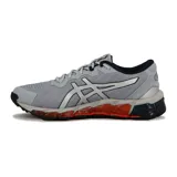 Championes Asics Gel-Quantum 360 Direction, de color gris con detalles plateados, negros y naranjas en la suela. Diseño deportivo con capellada de malla transpirable y tecnología de amortiguación visible en la suela.