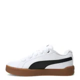 Championes urbanos Puma modelo Park Lifestyle Easy, color blanco con la icónica franja lateral en negro y suela de goma color caramelo. Diseño de corte bajo con cordones anchos y puntera perforada para mayor ventilación.