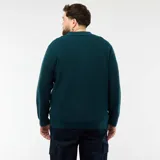Sweater de punto en color azul oscuro, con cuello tipo polo y cierre frontal de tres botones. Presenta un diseño de manga larga con puños acanalados y una textura sutil en el tejido.