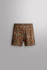 Shorts deportivos de Zara Athleticz confeccionados en tejido técnico ligero con estampado camuflado en tonos marrones y naranjas. Poseen cintura elástica ajustable, forro interior y aberturas en el bajo.