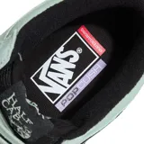Championes de skate Vans modelo Half Cab, caña media, en color verde menta con suela y cordones negros. Presenta el parche 'Half Cab' en el lateral.