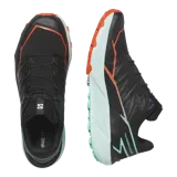 Championes de trail running Salomon Thundercross, color negro con suela verde menta y detalles en naranja. Cuentan con tacos agresivos de 5 mm, amortiguación dinámica y sistema de ajuste preciso.