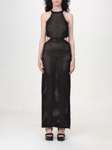 Vestido largo negro calado de malla con lunares brillantes, cuello halter, cortes en los laterales, aberturas laterales y forro.