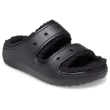 Sandalias tipo mule negras con plataforma, forradas con material afelpado negro en las tiras y el interior. Presentan dos tiras ajustables con hebillas y orificios para dijes Jibbitz™.