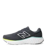 Championes de running New Balance modelo Evoz con tecnología Fresh Foam en la entresuela. Presentan un diseño en color gris oscuro con detalles en verde neón y turquesa, con el logo característico en los laterales.