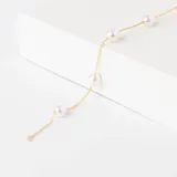 Pulsera de cadena fina en oro 18k con perlas de cultivo intercaladas.