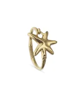 Pulsera rígida de metal dorado con diseño de estrella de mar y detalle de resorte.