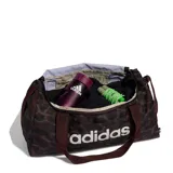 Bolso deportivo Adidas con diseño de estampado animal print en tonos marrones y negros. Cuenta con correas de mano, correa ajustable para el hombro con hombrera acolchada y logo de la marca estampado en el frente.