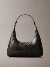 Cartera de hombro de Calvin Klein en color negro con estampado integral geométrico y de monograma. Cuenta con cierre de cremallera superior y una correa ajustable.