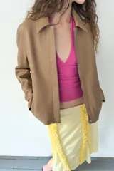 Top de algodón con cuello halter y escote en pico profundo, de diseño ajustado y sin mangas.