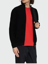 Cardigan de punto negro Moncler, de corte recto, con cuello alto, cierre frontal completo con cremallera y mangas largas.