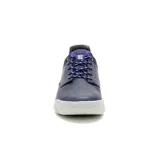 Zapatillas Caterpillar Hex Lite Leather, color azul marino con detalles en violeta y suela blanca.
