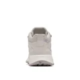 Bota de senderismo Columbia modelo Peakfreak Hera Mid, color blanco hueso. Presenta un diseño de caña media con tecnología impermeable OutDry, sistema de ajuste Navic Fit en el mediopié y suela con tacos de 5 mm para tracción en terrenos difíciles.