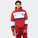 Canguro con capucha de la marca Umbro, oficial del Club Nacional de Football. Presenta un diseño tricolor con bloques en rojo, blanco y azul, bolsillo frontal tipo canguro y cordones ajustables en la capucha.